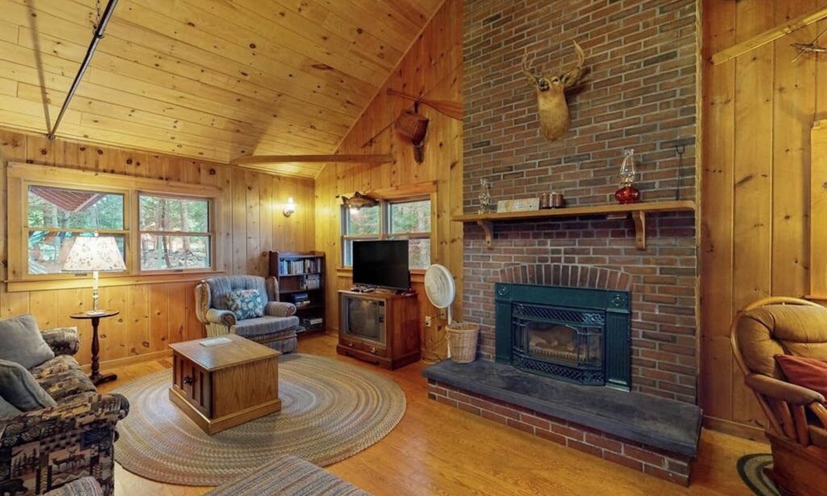 Greenville Junction House | Lakefront Home with Private Dock, Pebble Beach & Enclosed Porch - Dogs Welcome
