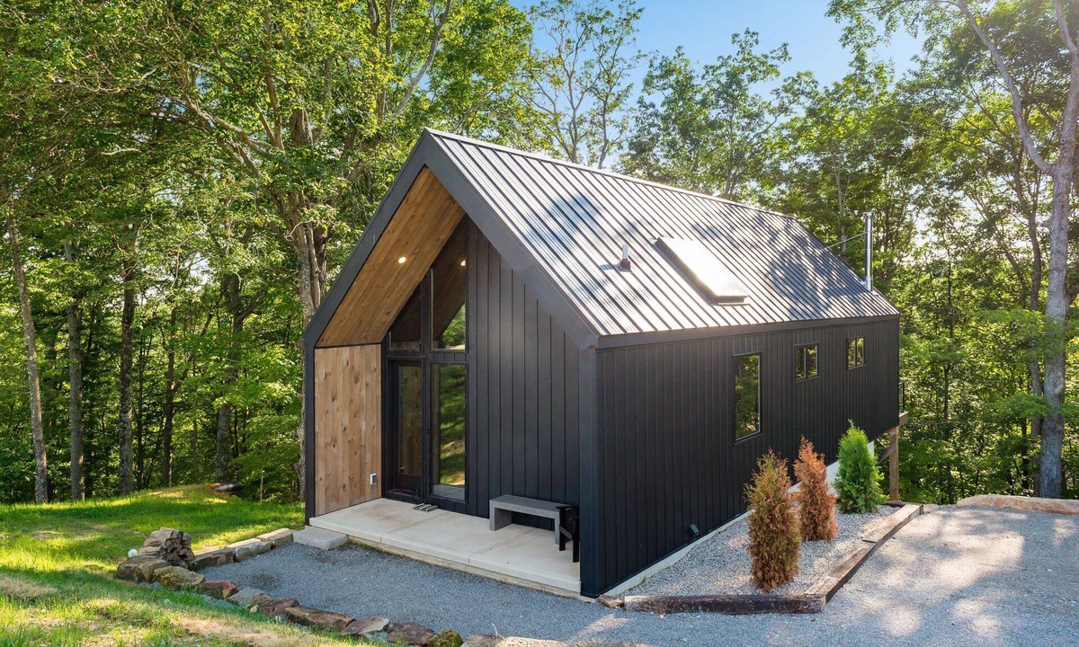New Plymouth Cabin | Luxury Couples Cabin in Hocking Hills, Ohio with private hot tub and outdoor fireplace on covered private balcony with forest views.