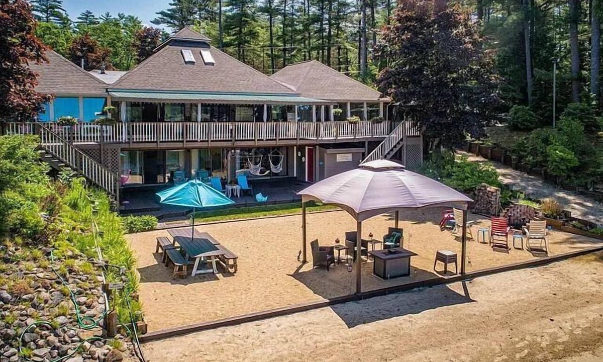 Milton House | Luxury Lakehouse with Large Private Beach, Hottub, Tiki Bar, 100’ Covered Deck, and Dock