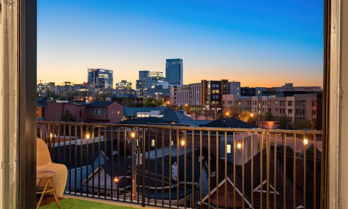 Rolling Mill Hill Apartment | Summer rooftop deck, skyline views, garage-door kitchen near Broadway