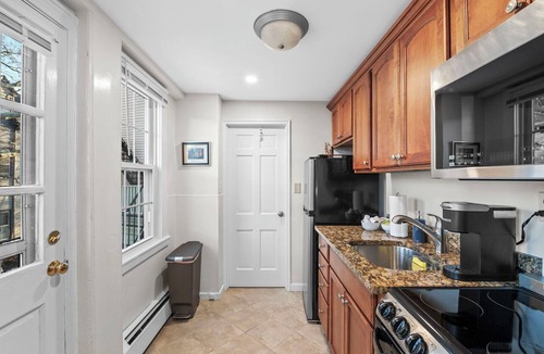 Salem Apartment | 1BR on Salem Common l Steps to Witch Museum and Downtown l Fenced in Yard