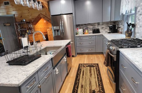 East Wakefield Cabin | Beautiful log cabin on clear serene Province Lake with private beach.