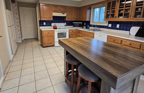 Warrensburg House | Charming 3-bedroom farmhouse with large front and back decks. Fenced in backyard