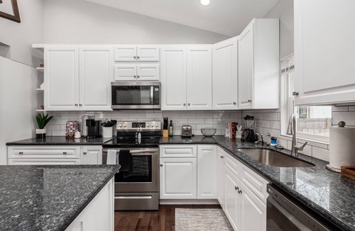 West Columbus House | Charming 4-bedroom home with a pool table, spacious living, & modern kitchen.