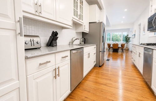 Branford House | Coastal Modern Retreat: Private Beach Access & Water Views
