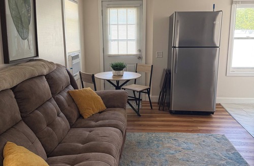 Warwick House | Cozy Oakland Beach bungalow for 2! One block from the water and a short walk to beaches, restaurants, and shops. Includes a living room, kitchen, bedroom, and full bath.