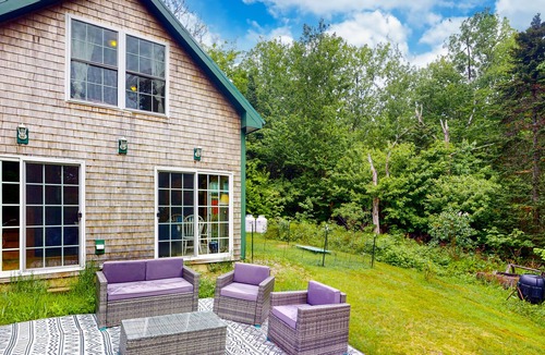 Stockton Springs Cottage | Dog-friendly home in the trees with ocean view & patio - near Fort Point