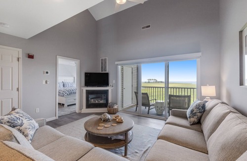 Ocean View House | Fantastic Bethany Bay gem with shared pool, screened porch, bay views & WiFi