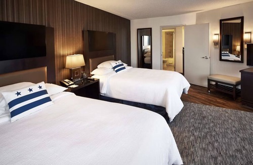 Friendship Heights Hotel | Hotel Suite near American University | Indoor Pool | Breakfast | 4 Cozy Units