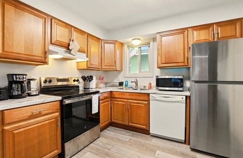 Tudor Area House | Hugs In The Dusk - 2 Beds 1 Bath unit—one side of a duplex in Midtown Anchorage.