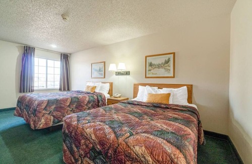 Texhoma Hotel | Inviting Two-Queen Room Conveniently Close to Dining Spots