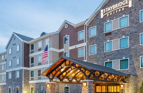 North Canton Condo | King Suite. Free Breakfast Buffet. Pool & Hot Tub Access.