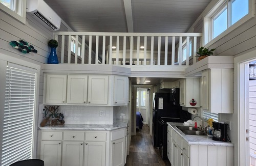 Berryville Cabin | Lake Side Tiny Home, large deck.