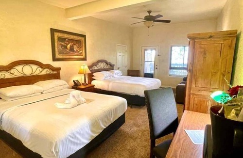 Mount Ida Hotel | Lake View Queen Guest Room With Two Queens, Sleeper Sofa And Patio Overlooking Lake Ouachita. 1 Bedroom Hotel Room by RedAwning