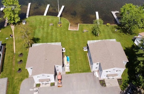 Lochmere House | Lakefront 3-bedroom Duplex on Lake Winnisquam, docks, Beach, WiFi, AC. B2B