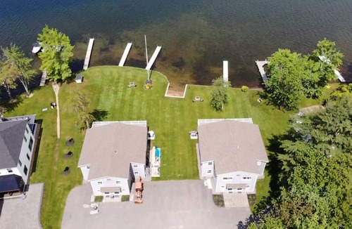 Lochmere House | Lakefront 3-bedroom Duplex on Lake Winnisquam, docks, Beach, WiFi, AC. B2B