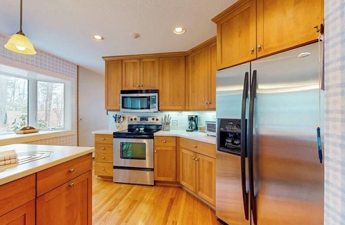 Bridgton Condo | Lakefront condo with on-site pool, dock, swimming, firepit, & tennis
