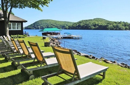 New Preston House | Lakefront Home set on five acres of land, deck, patio, lounge seating by...
