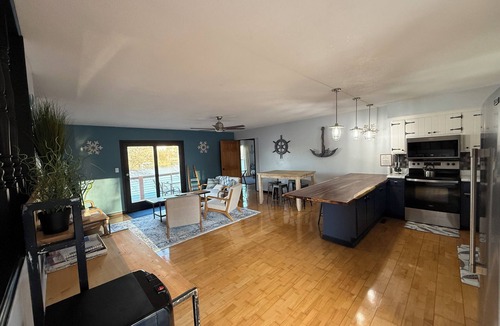 Warsaw House | Lakefront Retreat + private dock + game room + large patio pizza oven bar