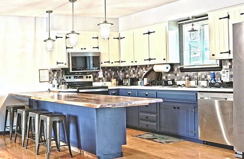 Warsaw House | Lakefront Retreat + private dock + game room + large patio pizza oven bar