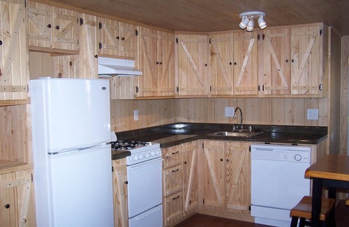 New Plymouth Cabin | Located behind a tree filled garden near our horse barn and Farm Sanctuary.
