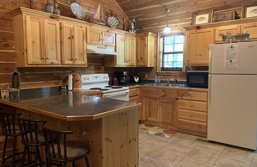 Mid America Cabin | Located directly on the water — private boat slip, boat ramp, and swim area.