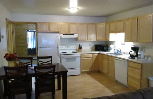 Moose Creek Apartment | Log 3-Bdr in Moose Creek among the birch and spruce trees