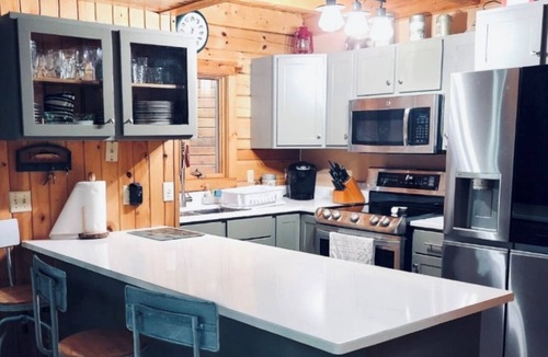 Lowell House | Log home on untouched cold stream lake