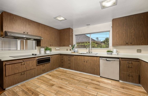 East Pasadena House | Luxurious large master bedroom with separate refrigerator coffee maker bathtub
