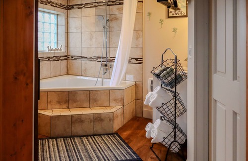 Logan Hotel | Luxury King suite with air-jet jacuzzi , private entrance & deck