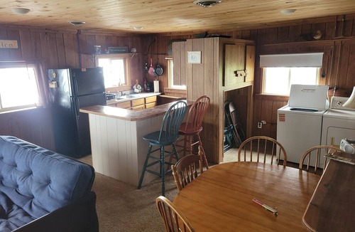 Derby Cabin | Merrymaker Cabin Riverfront with hot tub and Wi-Fi sleeps 8