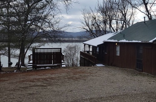 Derby Cabin | Merrymaker Cabin Riverfront with hot tub and Wi-Fi sleeps 8
