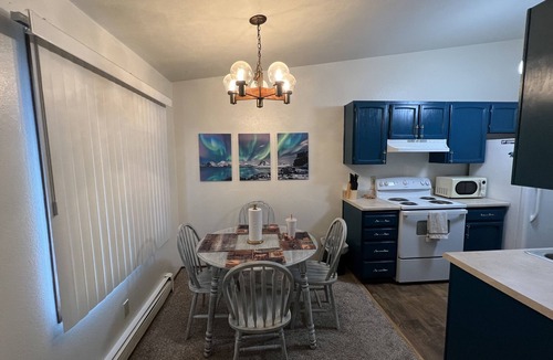 Russian Jack Park Condo | One bedroom top floor condo with Mountain View from bedroom and covered parking