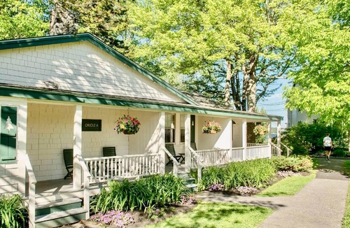 Boothbay Harbor Condo | Oriole Suite | Stone Fireplace + Woodland