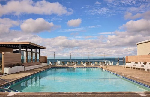 Silver Beach Hotel | Perfect Spot for Soaking Up Some Sun! Private Beach, Onsite Pools and Parking!