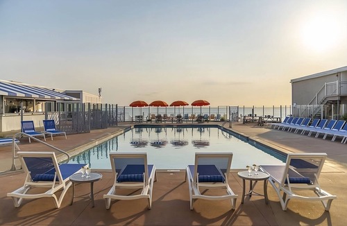 Silver Beach Hotel | Perfect Spot for Soaking Up Some Sun! Private Beach, Onsite Pools and Parking!