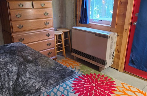 Charlotte Cabin | Round Lake Cabin. Escape to lake life close to amenities and attractions.