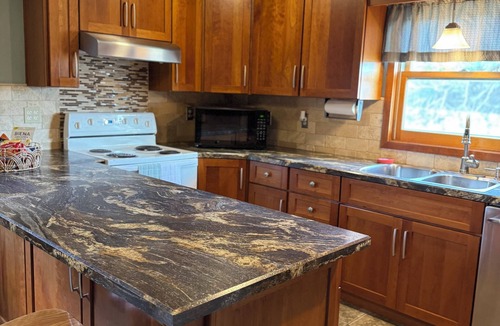 Mitchell County House | Serene 2-bedroom house with bunkroom in charming Cawker City, Fully furnished.