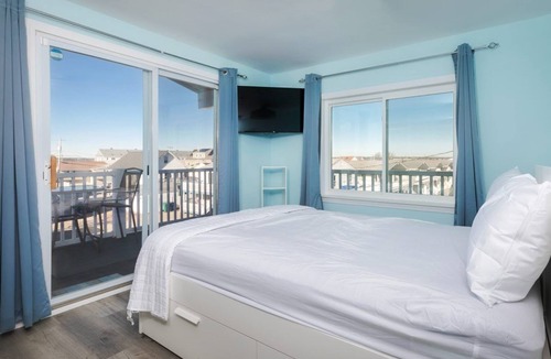 Hampton Condo | Short stroll to the beach! Newly renovated, 3 bedroom condo, wrap around porch