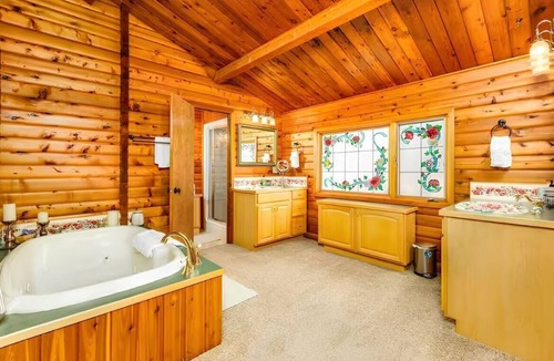 Sand Lake House | Spacious Lakeside Home with Firepit, Wraparound Deck, Kayaks & Gym