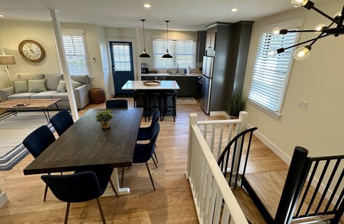 Yachting Village Hotel | Stunning downtown Newport RI vibes in this stunning renovated 2BR apartment off Historic Thames Street! 2 queen beds + pull-out sofa (sleeps 6), full stocked kitchen, private deck entry, AC, 2 TVs, off-street parking. Steps to dining, wharfs. Enjoy!