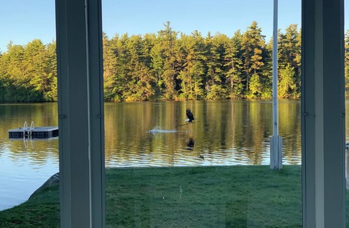 Sanbornville House | Stunning lakefront home with a boathouse, private dock, firepit and lake views