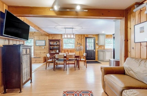 Pine River Pond House | Stunning lakefront home with private dock, deck, firepit, and lake view