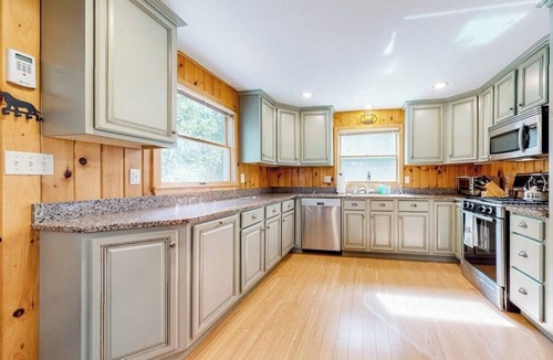 Pine River Pond House | Stunning lakefront home with private dock, deck, firepit, and lake view