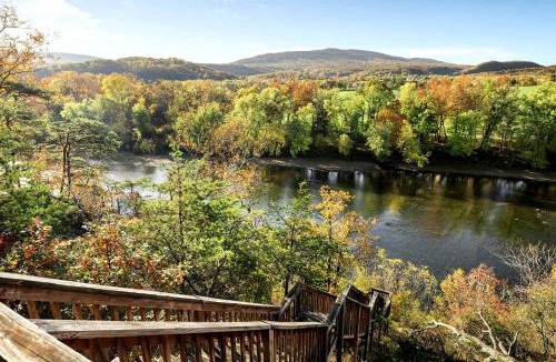 Paw Paw House | Stunning Secluded Log Cabin with River Access in Paw Paw, Maryland