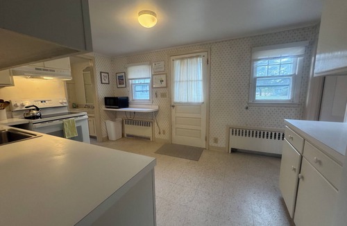 Pipes Cove Cottage | 'The Gate House'on Beach front Estate with Dockage. Walk to Village .
