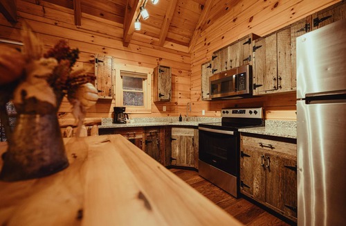 South Bloomingville Cabin | The Hilltop - The Hilltop at Pine Creek Cabins and Camping in Hocking Hills, just minutes from Hocking Hills State Park. A cozy, yet spacious, pet-friendly cabin perfect for a reset surrounded by nature! Book your getaway today!
