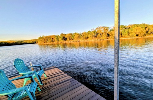 Okmulgee House | The Lake House is a Private Lake Escape with Covered Dock+Swim Platform+Fire Pit