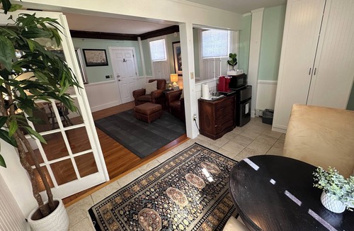 Newport Hotel | This large praivate , one-of-a-kind, dog friendly gem of a unit, in heart of historic Newport. King bed, ensuite bath, living & seating area, AC, highs speed Wifi, TV, mini fridge, coffee station. Just steps to Thames Street, shops, wharfs!