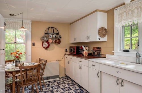 Melvin Village House | Timeless lakefront home on Lake Winnipesaukee with screened-in porch and dock